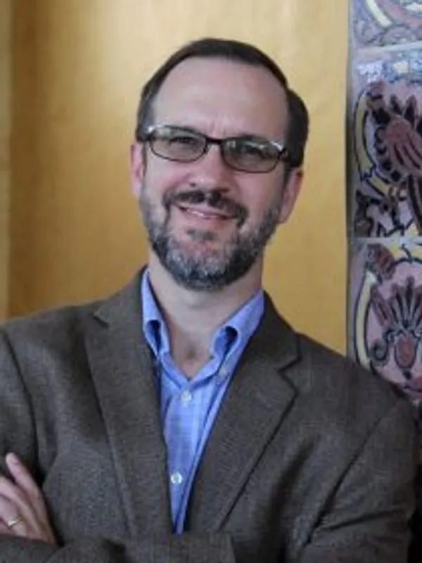 Headshot of Aaron Burke.