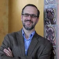 A headshot of Aaron Burke