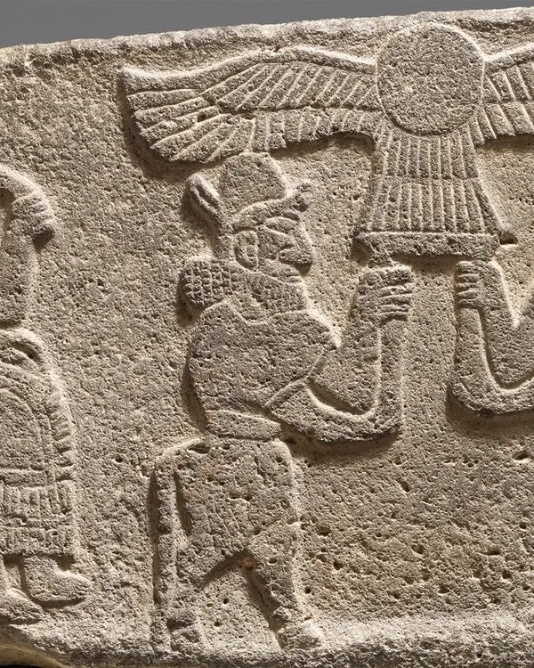 Neo-Hittite Orthostat relief: seated figure holding a lotus flower.