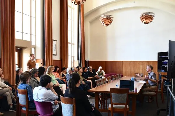 David Schaberg presents a faculty lunch lecture to a room of attendees.